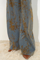 Women's barrel leg jeans with floral flocked jacquard denim and brown pointed shoes