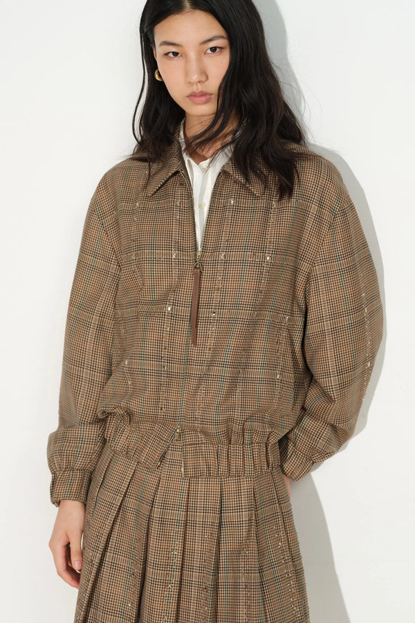 Brown checked crystal embellished bomber jacket worn by a model