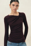 Dark brown asymmetric ruched knit top with twisted neckline and long sleeves
