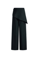 Black pinstripe wide leg pants with an asymmetrical wrap scarf overlay