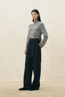 Black wide leg wool blend pants with a tied French style scarf waist