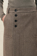 Houndstooth wool blend pencil skirt with asymmetric button placket and roomy pocket