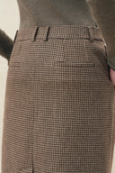 Houndstooth wool blend pencil skirt with asymmetric placket and welt pocket