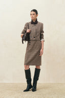 Houndstooth wool blend pencil skirt with an asymmetric button placket and hem slit