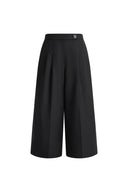 Black cropped wide leg wool blend pants with a high waist and pleated front detail