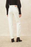 Ivory straight leg jeans with back pockets and turned cuffs, back view