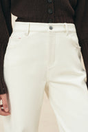 Ivory women's straight leg jeans with tonal stitching and five pocket styling
