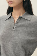 Grey wool blend knit polo top with a wide collar, button placket and long sleeves